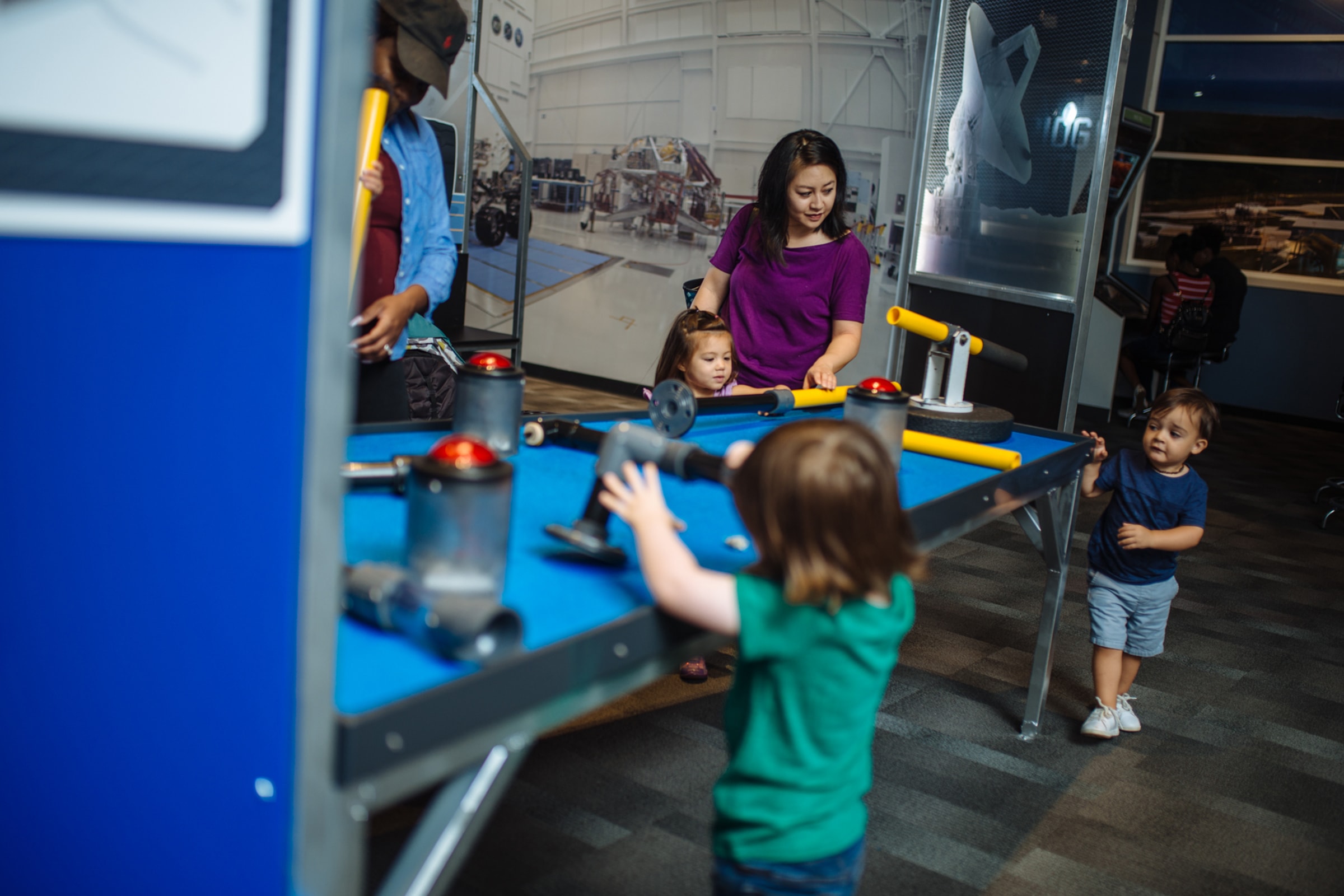 Families playing in Mission Mars Control
