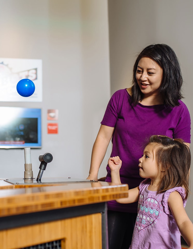 Saint Louis Science Center Woman and Girl Playing